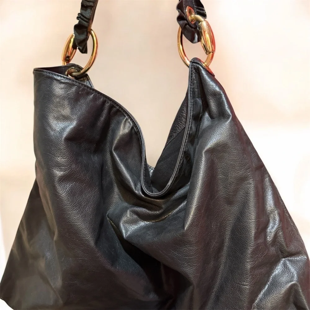 Gucci black leather hobo bag with gold detail